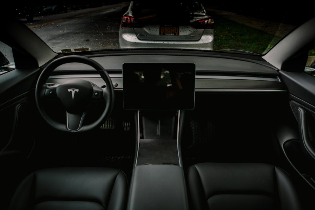Black interior with woodgrain dash wrapped in vinyl – Tesla Model 3 Wiki