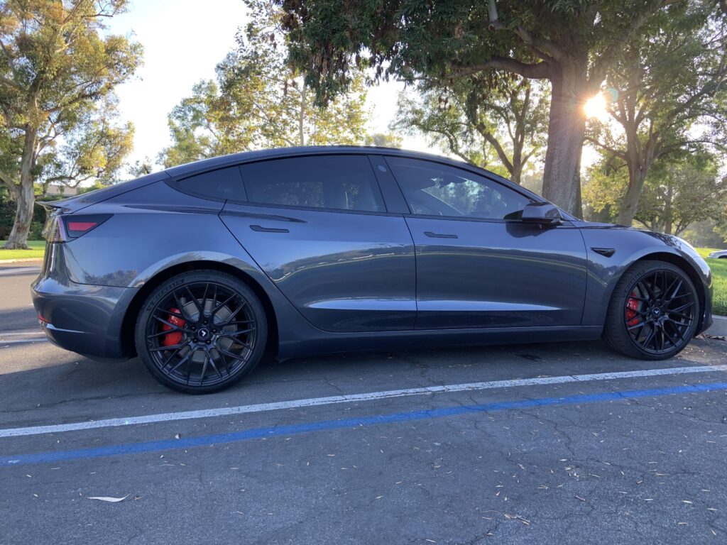 MSM Tesla Model 3 with aftermarket 20″ wheels, chrome delete, tinted